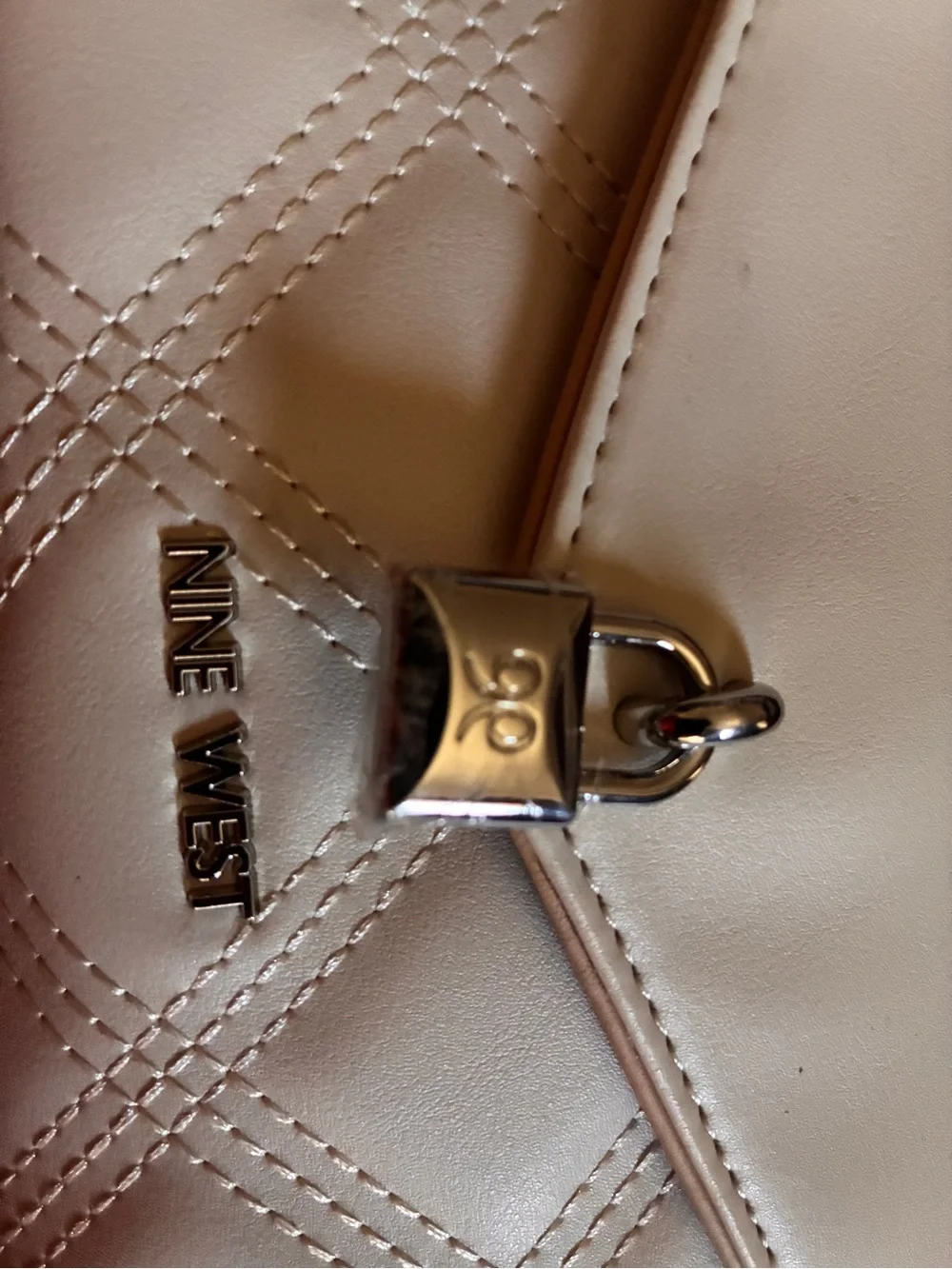 Nine West Cream Quilted Wristlet with Padlock Detail